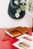 Modern home with Office, Craft Room Room Type, and Desk. A knitted navy sack holds chalk for the taking when one is inspired to use the family chalkboard. Photo 3 of Going Old School in The Bay Area
