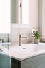 Modern home with Marble Floor, Drop In Sink, Ceiling Lighting, Wall Lighting, Marble Wall, Enclosed Shower, and Recessed Lighting. The intergrated sink vanity top makes for easy cleaning and a minimal look. Photo 8 of Catching Waves In San Francisco