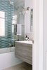 Modern home with Marble Floor, Drop In Sink, Enclosed Shower, Undermount Tub, Ceiling Lighting, Wall Lighting, Recessed Lighting, Mosaic Tile Wall, and Stone Tile Wall. A custom glass panel provides additional towel space with a builtin towel bar. Photo 12 of Catching Waves In San Francisco
