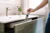 Modern home with Marble Floor, Drop In Sink, Engineered Quartz Counter, Marble Wall, and Bath Room. A large drawer front exposes two interior drawers divided for organizational needs. Photo 6 of Catching Waves In San Francisco