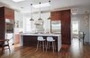 Tall ceiling and tall cabinets anchor this large multi-purpose room. Photo 4 of A Kitchen for the Boys modern home