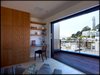 Cost tower anchors the North end of the axis running through the house. Views from the deck include the full width of the Golden Gate Bridge. Photo 4 of Telegraph Hill Bachelor Pad modern home