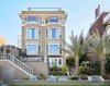 Prior to this project, the rear elevation was a tangled mess of odd sized windows and balconies that were never completed. We gave it symmetry and scale to compliment the orderliness of the rest of the house. Photo of Pacific Heights Historic Renovation modern home