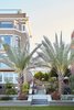 Twin palm trees flank the stairs from a large gathering terrace to the tennis court sized lawn. Photo 2 of Pacific Heights Historic Renovation modern home