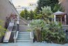 With three kids in the house, a slide makes a way more fun trip from the playing court to the terrace. Adults can descend those boring stairs. Photo 3 of Pacific Heights Historic Renovation modern home