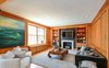 Modern home with Living Room, Coffee Tables, Chair, Sofa, End Tables, Standard Layout Fireplace, Medium Hardwood Floor, Recessed Lighting, and Recliner. Living Room West Photo of Town & Country