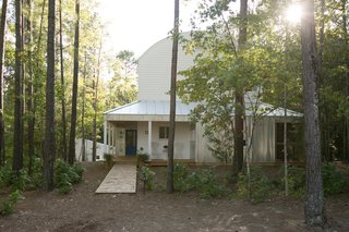 Farmhouse-style homes feature corrugated metal, standing-seam metal roofs, and wood siding.