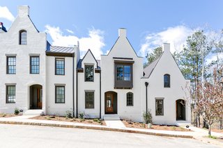 Even townhouses located next to each other are distinct while featuring the same architectural language.