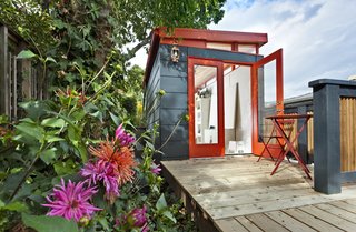 In Seattle, an artist sought an affordable option for her own studio and looked to Modern Shed, a company that provides solutions for storage and limited living spaces like studios and office sheds. Metal panels in gray and red clad the exterior, and natural light pours in through glazed double doors and clerestory windows.