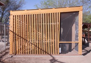 The walls are made largely of dimensional lumber in standard sizes as well as wire mesh. Some lumber was pressure treated to avoid rot and termite damage.