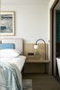 Modern home with Bedroom, Bed, Rug Floor, Floor Lighting, and Night Stands. An integrated headboard and bedside table in one of the hotel's bedrooms. Photo 5 of PURO Kraków Kazimierz