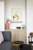 Modern home with Living Room, Chair, Sofa, Rug Floor, and Table Lighting. Simple shapes, subdued colors, and natural textures from wood and marble are found throughout the hotel. Photo 7 of PURO Kraków Kazimierz