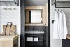 Modern home with Bath Room, Drop In Sink, and Wall Mount Sink. A guest bathroom is revealed with a sliding pocket door. Photo 8 of PURO Kraków Kazimierz