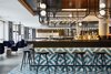 Modern home with Dining Room, Chair, Recessed Lighting, Bar, Wall Lighting, and Stools. The hotel's independent restaurant features Polish cuisine with a modern twist. Photo 10 of PURO Kraków Kazimierz