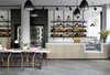 Modern home with Dining Room, Chair, Track Lighting, Pendant Lighting, and Table. The hotel also has an independent cafe where guests can purchase coffee and baked goods. Photo 12 of PURO Kraków Kazimierz