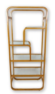 One of the hallmarks of midcentury design is the use of newly developed materials such as plywood, which is more malleable and bendable than solid wood. This bent plywood standing shelf, with its rounded frame and tiers of arched shelves, would make a great backdrop for books or accessories with a pop of color.