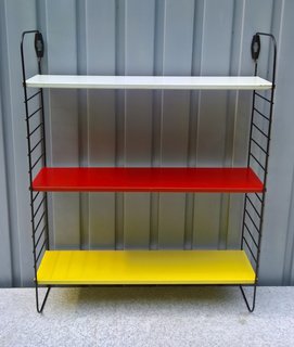 Originally founded as a kitchenware company in the Netherlands in the 1920s, Tomado began making metal items (including cookware, small appliances, and storage solutions) in the 1940s and 1950s. This set of metal shelves is a great example of the types of pieces they made—it’s highly functional, easy to assemble, and brightly colored, reminiscent of the Dutch De Stijl movement.