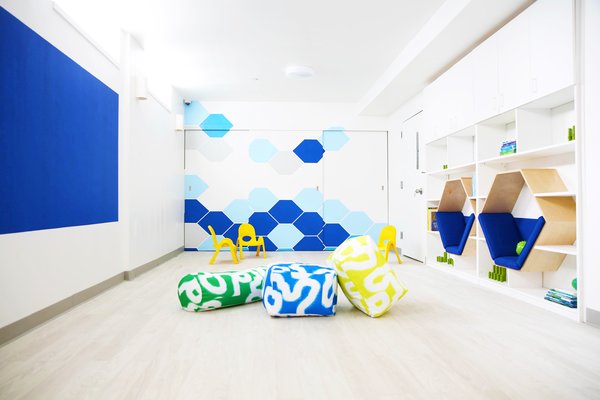 Working with architect Dennis George, interior design firm Ishka Designs provided a comprehensive interior design solution for the gut renovation of a former thrift store into Discovery Pitstop Daycare. The bold yet minimalist design employs colors and forms to create a space that is both fun and inspiring but also simple, clean, and calm.