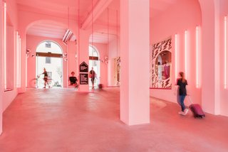 Pink neon lights give the palazzo's entry area an otherworldly feel.
