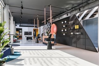 Finishes in the lobby area play with transparency and shadow—especially when light streams in through the large windows.