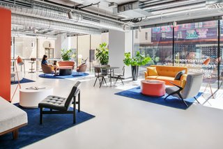 The communal area looks out into the courtyard between the building's two towers. Ample glazing allows plenty of daylight into the rooms.