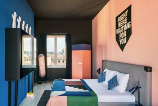 The guest rooms continue the design themes found in the rest of the hotel, with cheeky artwork, bold colors, and geometric textiles.