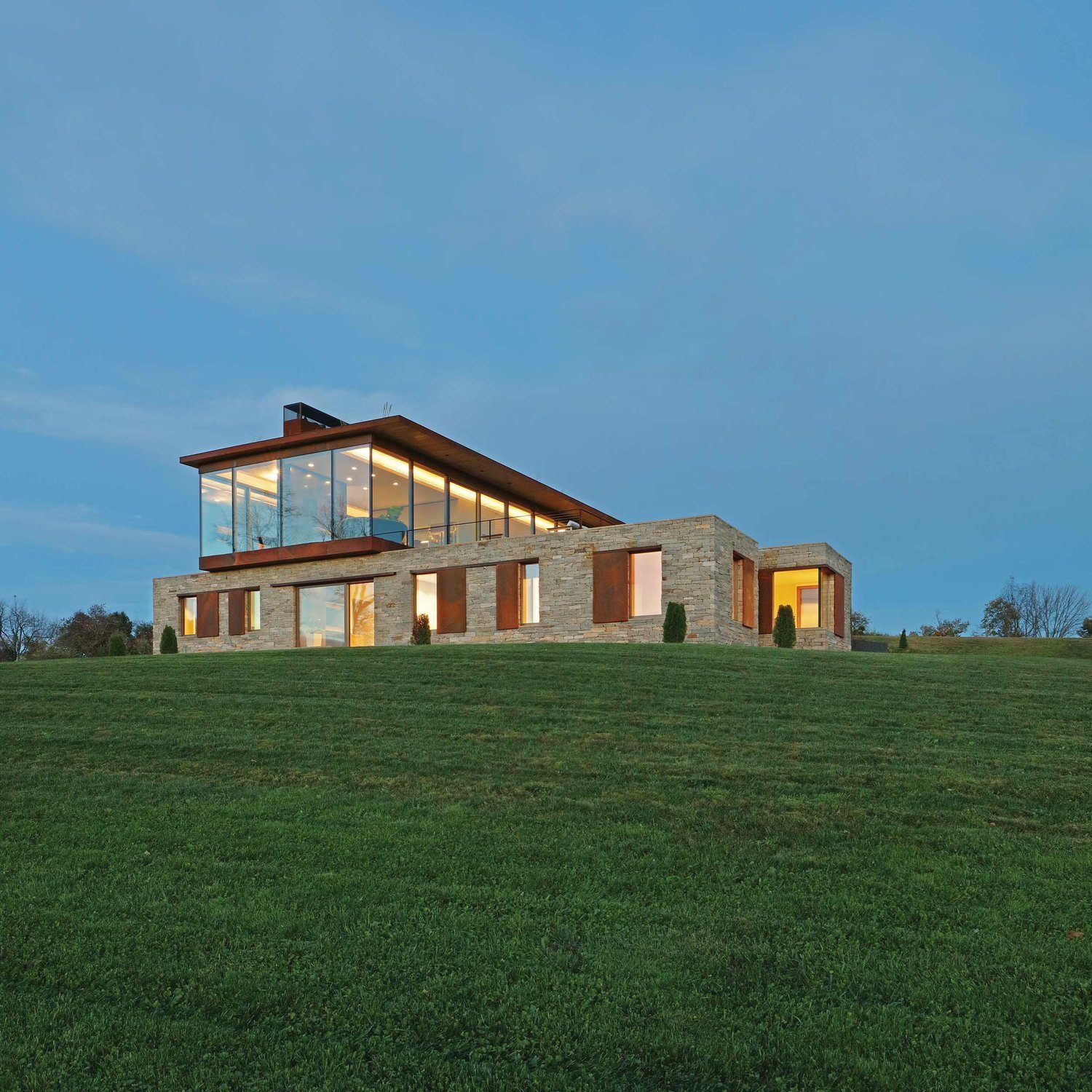 Photo 2 of 13 in A Green Home Made of Glass, Stone, and Wood Sits