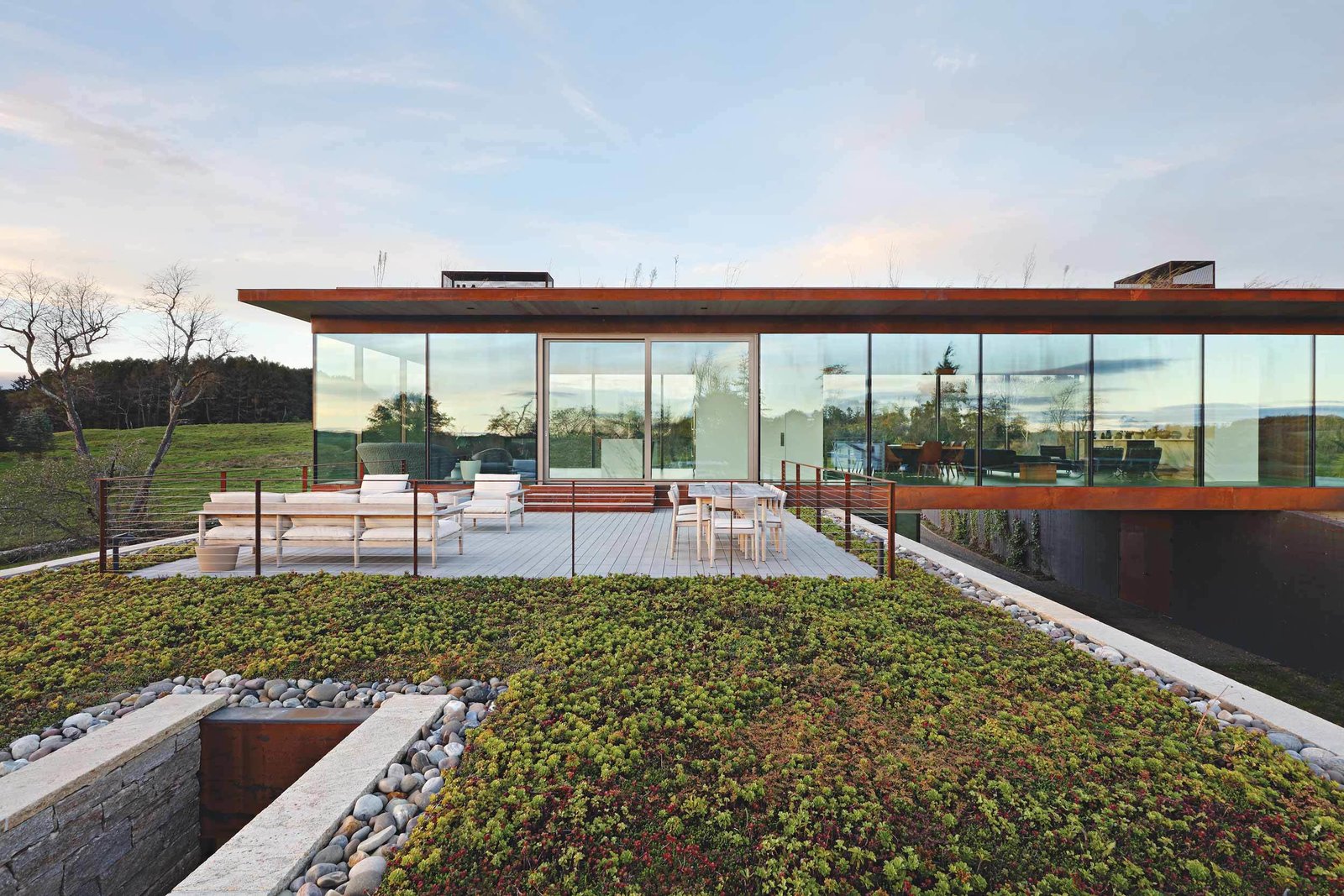 Photo 6 of 13 in A Green Home Made of Glass, Stone, and Wood Sits Lightly Upon the Land Dwell