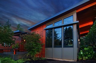 Clerestory windows bring in daylight, supplemented by museum-quality lighting, to highlight the homeowner's art collection.