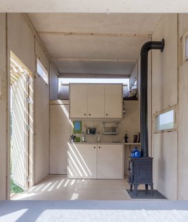 The home was prefabricated in Turkey and delivered to the site on the back of a flatbed truck. Thanks to the small size, simple design, and carefully selected palette, the project cost just under €10,000.