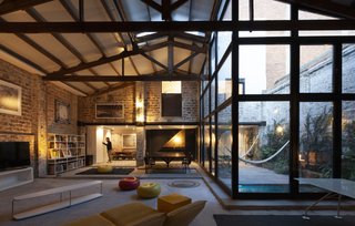 Originally built as a small theater, El Teatro was repurposed as a barn, and later a toilet paper factory, before being converted into a home by Cadaval & Sola-Morales.