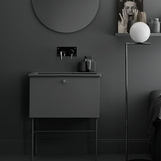 Swoon's Studio line of bathroom vanities are simple and minimalist, with slender legs and a single-pull drawer for the vanity.