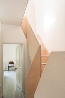 The stair was crafted from birch plywood and milled with a CNC mill so that it could be delivered and assembled as a kit of parts.