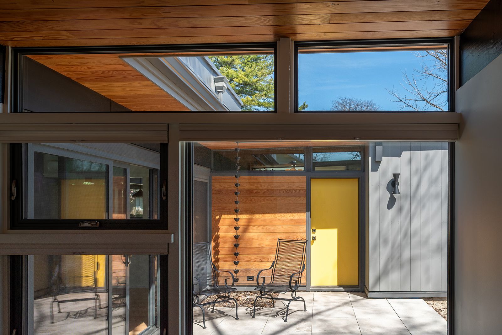 Keeping the roofs flat in appearance was key to maintaining the character-defining feature of the home -- despite the fact that it got new insulation, new drainage, and new solar panels.