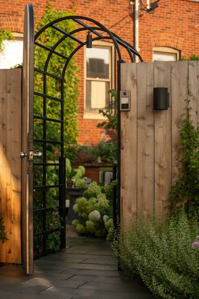 The opening in the fence serves as the main entrance onto the property