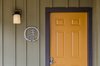 Modern home with Doors, Exterior, Metal, and Swing Door Type. Cabin entry with metal Pilot Cove logo. Exterior colors were selected from a palette inspired by the surrounding Pisgah National Forest. Photo 2 of Pilot Cove : Forest Lodging