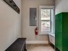 Designed with outdoor recreation travelers in mind, each cabin features a mudroom entry with concrete floor, washer, dryer, reclaimed wood coat rack, and locker storage for guest use. Photo 11 of Pilot Cove : Forest Lodging modern home