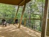 Modern home with Outdoor, Woodland, Trees, Decking Patio, Porch, Deck, Wood Patio, Porch, Deck, and Wire Fences, Wall. Expansive covered back decks provide a delightful outdoor space for guests to enjoy in every season. Photo 9 of Pilot Cove : Forest Lodging