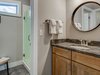 Modern home with Bath Room, Undermount Sink, Granite Counter, Concrete Floor, Enclosed Shower, Ceiling Lighting, and One Piece Toilet. Each bathroom is designed to accommodate multiple users simultaneously, including private showers and water closets. Bathroom mirrors were created from reclaimed mountain bike wheels. Photo 10 of Pilot Cove : Forest Lodging