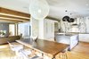 Modern home with Dining Room, Medium Hardwood Floor, Pendant Lighting, Ceiling Lighting, Table, Accent Lighting, Recessed Lighting, and Chair. Open floor plan, breeze from kitchen, dining and living room areas. Photo 3 of Oyster Shores