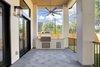 Outdoor Kitchen area on the covered patio. Photo of Braes Heights Home- Merrick modern home