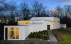 Designed by Anthony Wooiner, this striking residence in New York's northern suburbs blurs the line between indoors and out, flanked by dramatic glass walls that embrace the home's natural surroundings. It now awaits its next residents. Photo of Hycliff House modern home
