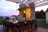The accent lighting in the outdoor kitchen sets the perfect mood for evening dining. Photo 5 of The Nowak Residence modern home