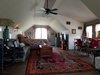 Modern home with Bedroom, Dresser, Wardrobe, Bed, Night Stands, Chair, Bench, Lamps, Ceiling Lighting, Table Lighting, Wall Lighting, Storage, Accent Lighting, Vinyl Floor, and Laminate Floor. Guest Suite Photo 5 of Modern Romantic Western Home For Sale