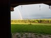 Modern home with Outdoor, Flowers, Grass, Trees, Front Yard, Hardscapes, Concrete Patio, Porch, Deck, Pavers Patio, Porch, Deck, Large Patio, Porch, Deck, Planters Patio, Porch, Deck, Wood Patio, Porch, Deck, Metal Fences, Wall, Hanging Lighting, and Landscape Lighting. Even has its own reoccurring double rainbow! Photo 9 of Modern Romantic Western Home For Sale