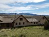 Modern home with Outdoor, Trees, Shrubs, Grass, Back Yard, Large Patio, Porch, Deck, Wood Patio, Porch, Deck, Metal Fences, Wall, Metal Patio, Porch, Deck, Concrete Patio, Porch, Deck, and Hanging Lighting. Back of Home. Super Warm Location! Photo 10 of Modern Romantic Western Home For Sale