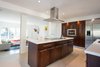 Custom Kitchen: Solid Cherry Casework, Quartz Countertops + Polished Concrete Floors Photo 16 of Edgewood modern home