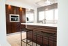 Custom Kitchen: Solid Cherry Casework, Quartz Countertops + Polished Concrete Floors Photo 12 of Edgewood modern home
