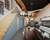 The dining and kitchen area are located on the first floor. The ceramic tile floor is from a local source, which is Cradle to Cradle certified. Photo 3 of Energy Neutral House modern home