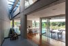 Entrance hall, view to the dining and living room, with the fireplace between Photo 7 of Black Pearl modern home